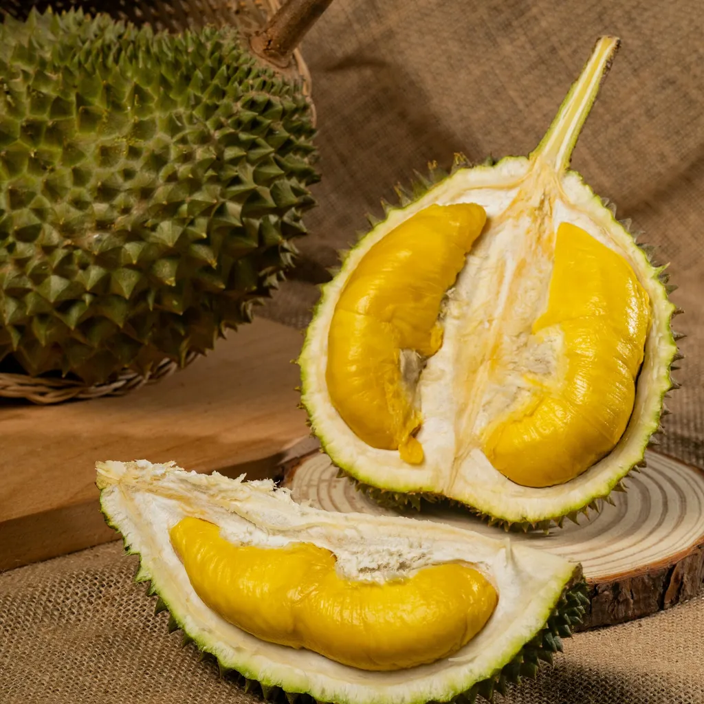 Close-up of Musang King pulp with its thick, creamy golden flesh
